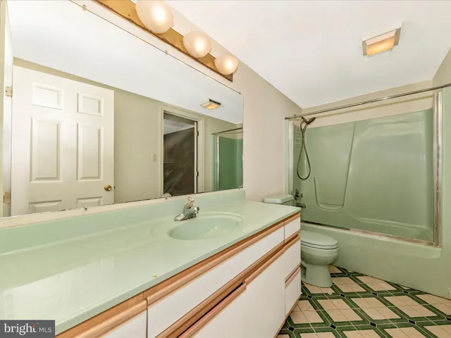 a front view of a house with a yard table and chairs