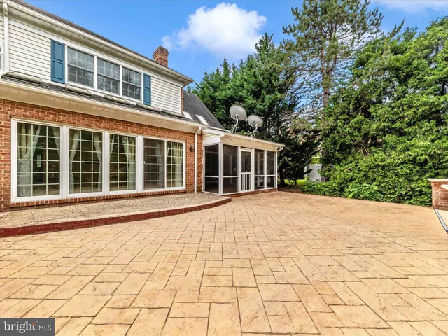 a view of a living room with hardwood floor and a ceiling fan