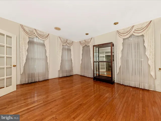 a view of an empty room with a fireplace