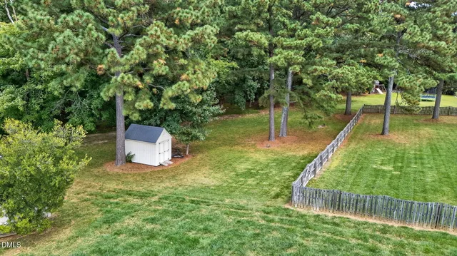a view of a park with large trees