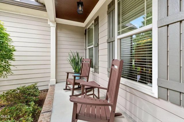 a view of a chair and table in the balcony
