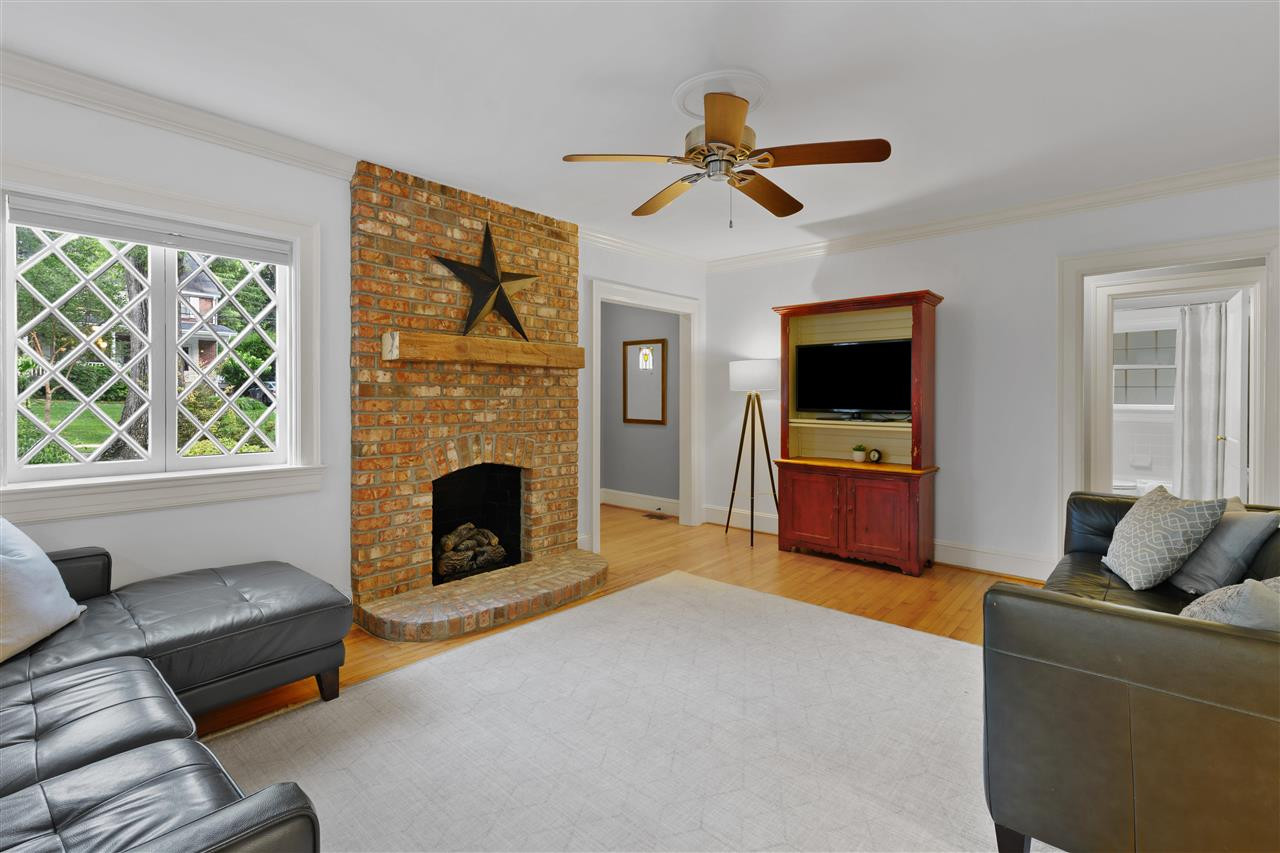 2618 Van Dyke Avenue Raleigh, NC 27607 - Photo 5 of 30 Natural light from front-facing windows flows into the living room. The ceiling fan is great for warm summer days, and the fireplace perfect for cold winter nights. Living Room