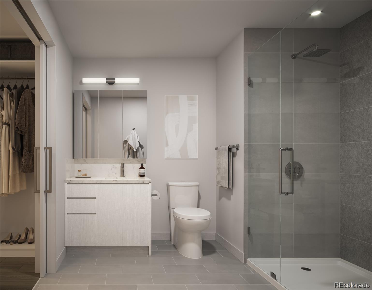 525 18th Street, Unit 1109 Denver, CO 80202 - Photo 4 of 13 a bathroom with a sink a toilet and shower