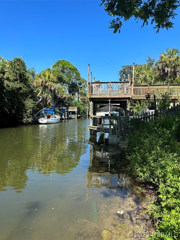 111 Lewis Street Edgewater, FL 32141 - Photo 5 of 11 a view of a lake with a building in front of it