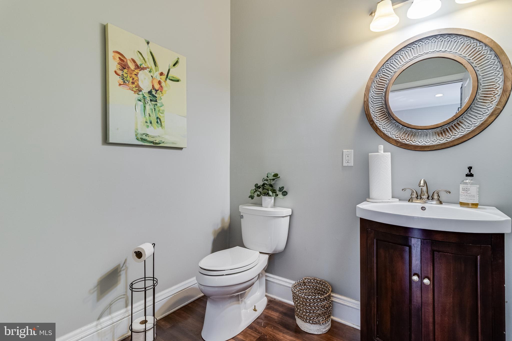 28055 Old Village Road Mechanicsville, MD 20659 - Photo 15 of 56 a bathroom with a toilet a sink and a mirror