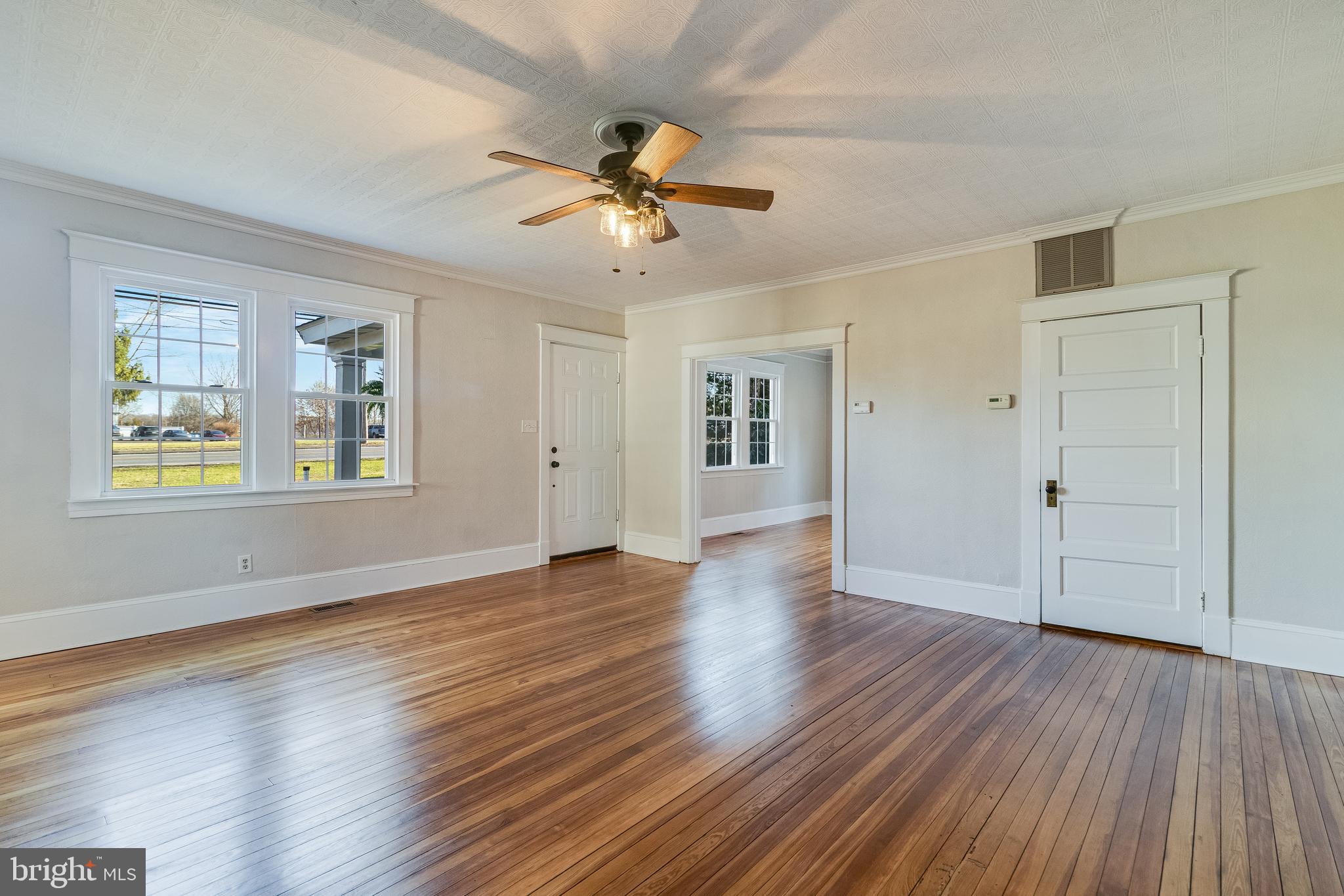 28055 Old Village Road Mechanicsville, MD 20659 - Photo 19 of 56 a view of an empty room with window and wooden floor