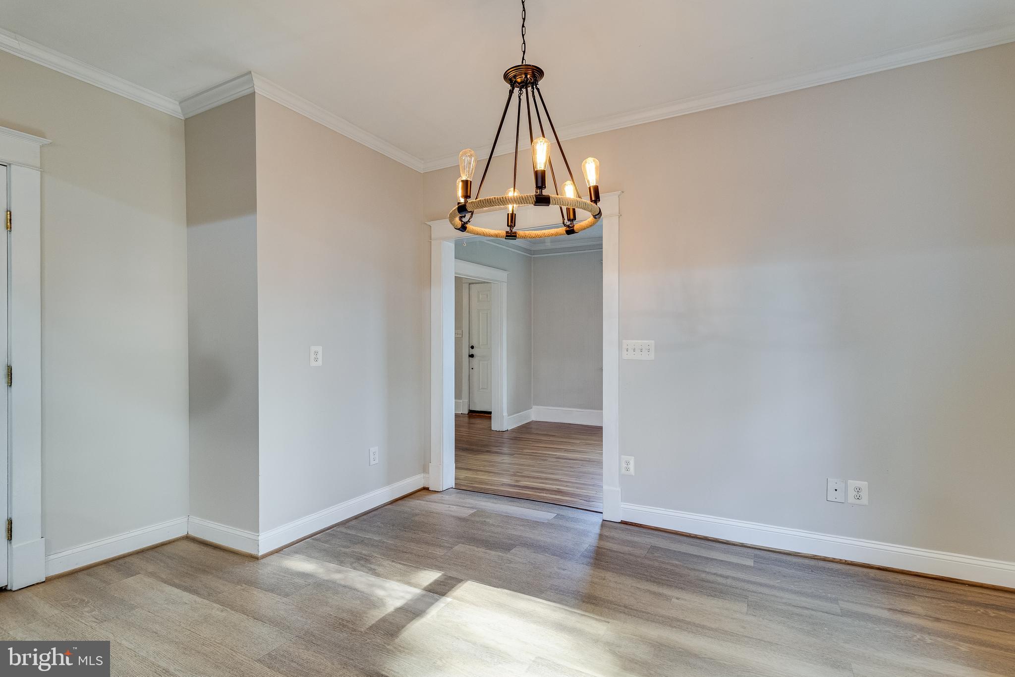 28055 Old Village Road Mechanicsville, MD 20659 - Photo 21 of 56 a view of a hallway with wooden floor and chandelier