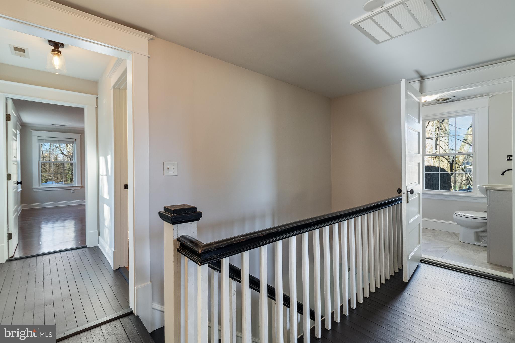 28055 Old Village Road Mechanicsville, MD 20659 - Photo 37 of 56 a view of a hallway view with wooden floor and staircase
