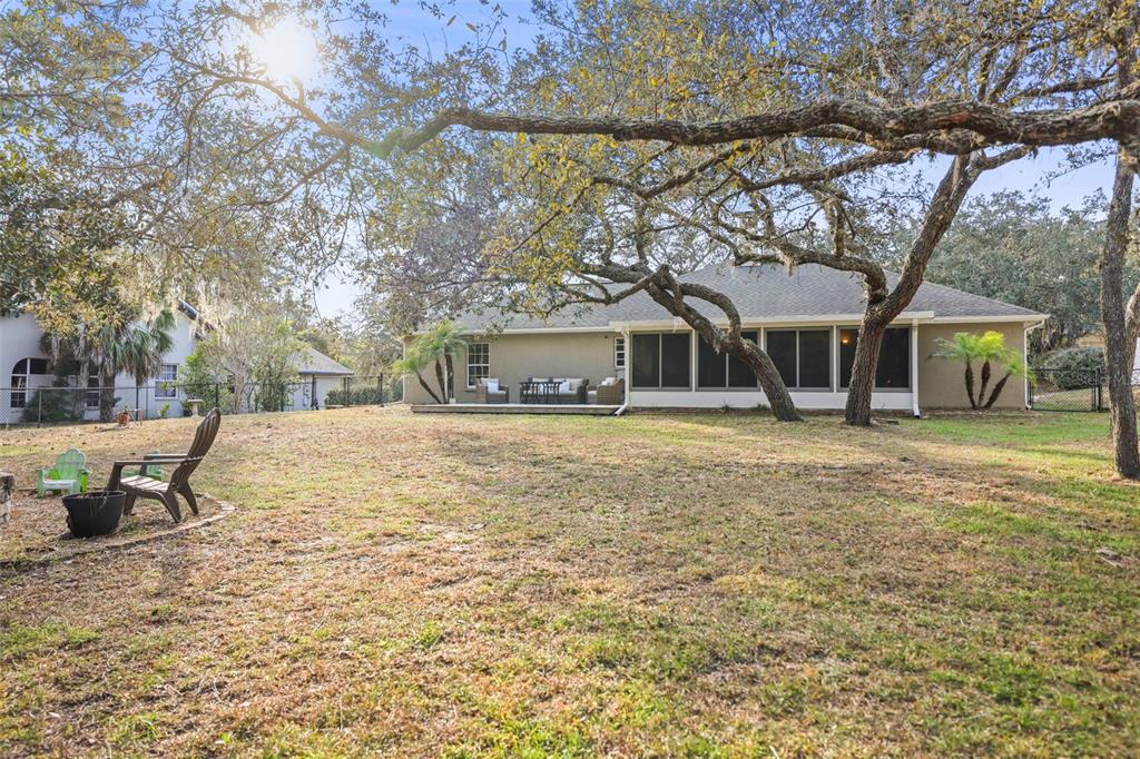 8412 Christopher Lane Weeki Wachee, FL 34613 - Photo 11 of 41 a house that has a tree in front of it