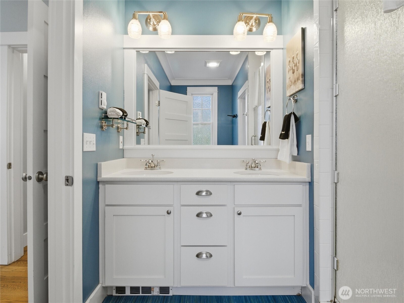 269 Compass Street Pacific Beach, WA 98571 - Photo 17 of 38 a bathroom with a sink vanity and a mirror