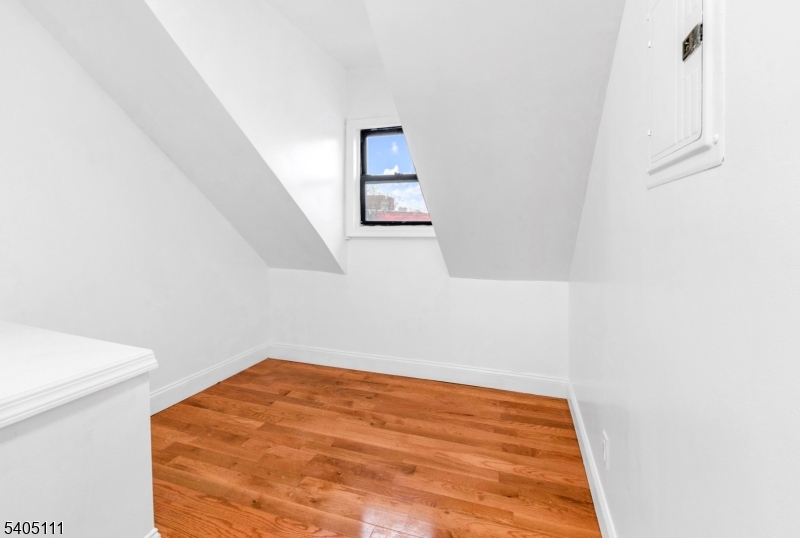 25 Oak Street, Unit 25 Paterson, NJ 07501 - Photo 17 of 25 a view of a room with wooden floor