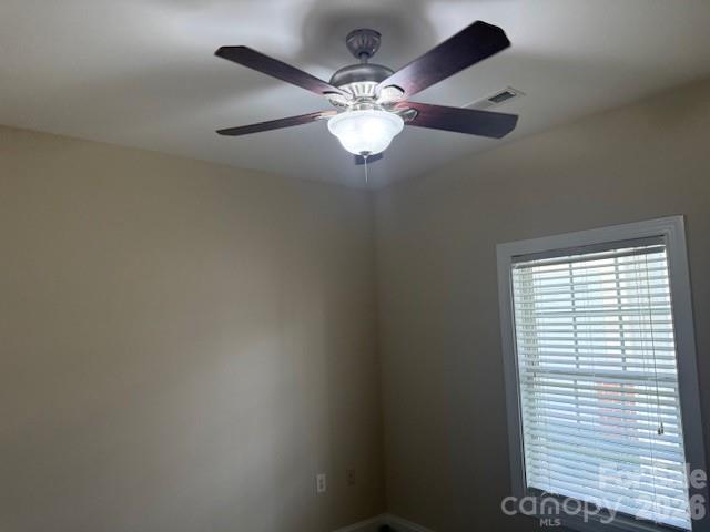 8913 Meadow Vista Road Charlotte, NC 28213 - Photo 14 of 30 en view of a livingroom with a ceiling fan and window