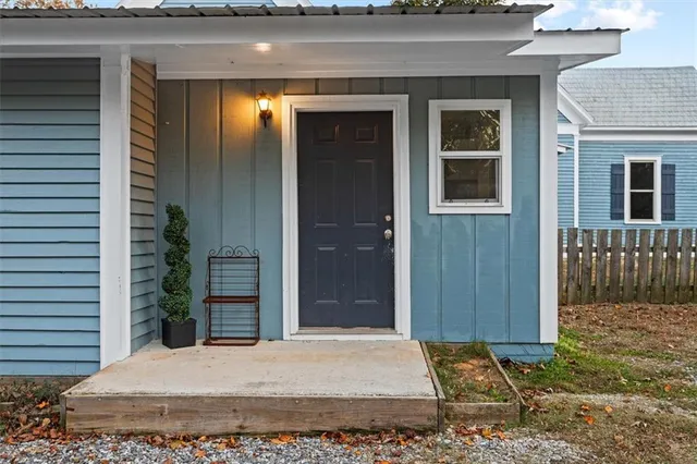 a kitchen with a white cabinets and window