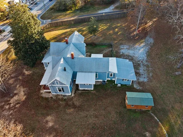 an aerial view of a house with swimming pool