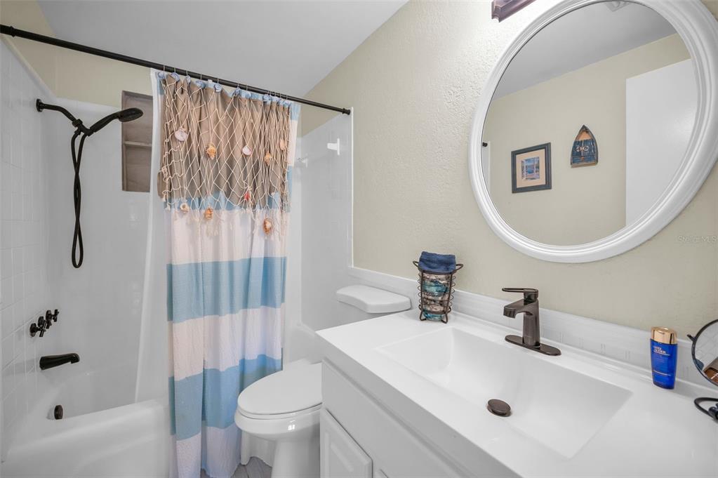 5433 Bluepoint Drive Port Richey, FL 34668 - Photo 14 of 50 a bathroom with a sink toilet and shower