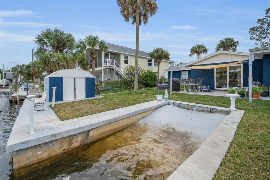 5433 Bluepoint Drive Port Richey, FL 34668 - Photo 22 of 50 a view of a house with yard and tree s
