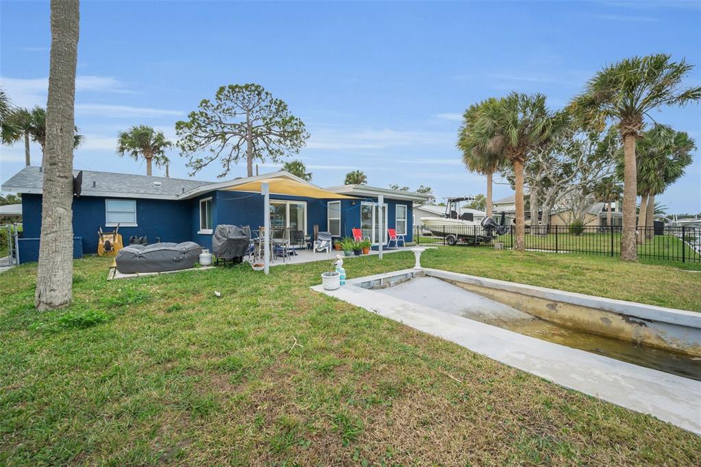 5433 Bluepoint Drive Port Richey, FL 34668 - Photo 24 of 50 a view of a house with a yard