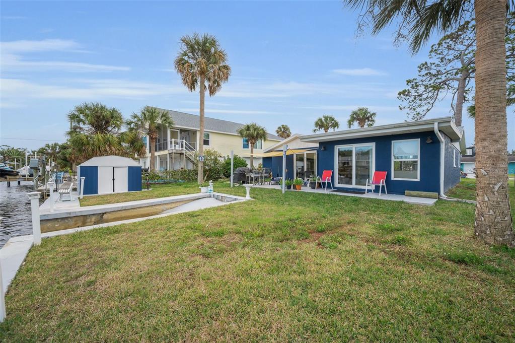 5433 Bluepoint Drive Port Richey, FL 34668 - Photo 25 of 50 a view of house with outdoor space and swimming pool