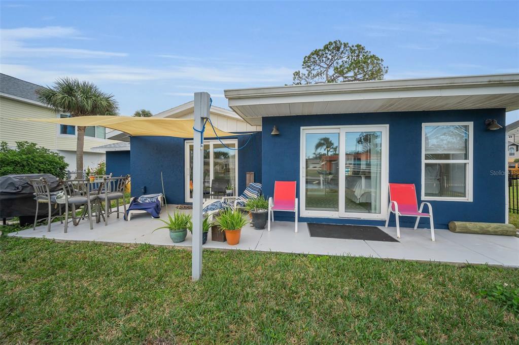 5433 Bluepoint Drive Port Richey, FL 34668 - Photo 26 of 50 a view of a chairs and table in backyard of the house