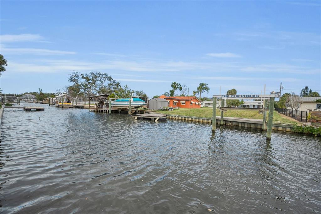 5433 Bluepoint Drive Port Richey, FL 34668 - Photo 28 of 50 a view of a lake with outdoor space