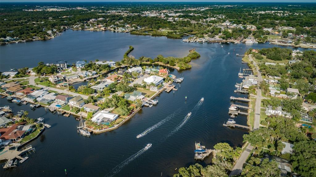5433 Bluepoint Drive Port Richey, FL 34668 - Photo 31 of 50 an aerial view of a house with a lake view