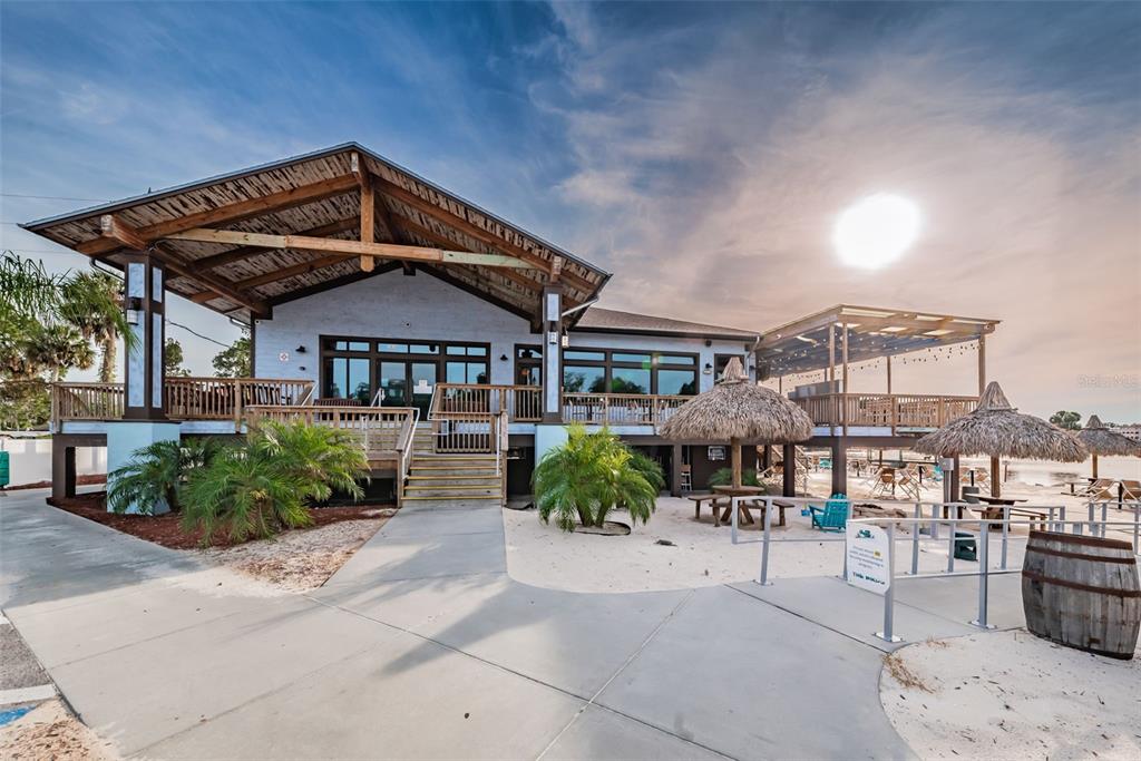 5433 Bluepoint Drive Port Richey, FL 34668 - Photo 39 of 50 a front view of a house with garden