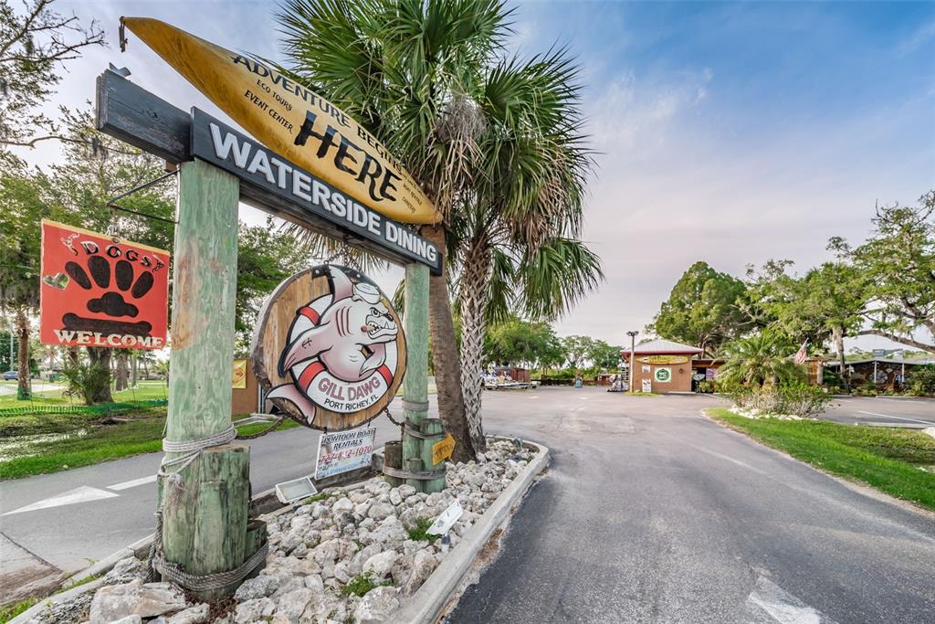 5433 Bluepoint Drive Port Richey, FL 34668 - Photo 43 of 50 a sign that is on the side of the road