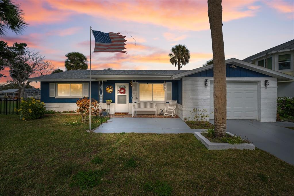 5433 Bluepoint Drive Port Richey, FL 34668 - Photo 50 of 50 a front view of house with yard and outdoor seating