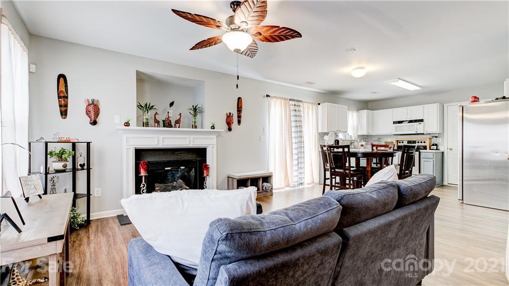 7103 Indian Ridge Lane Charlotte, NC 28214 - Photo 2 of 24 a living room with furniture and a fireplace