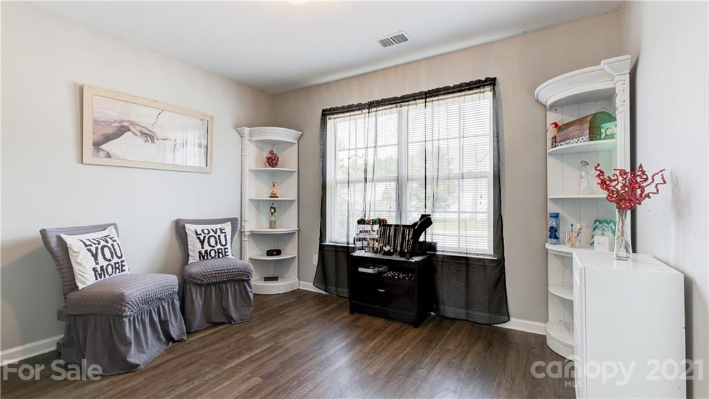 7103 Indian Ridge Lane Charlotte, NC 28214 - Photo 11 of 24 a living room with furniture and wooden floor