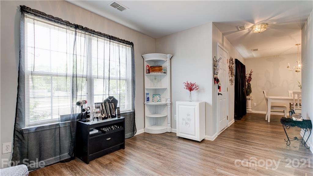 7103 Indian Ridge Lane Charlotte, NC 28214 - Photo 13 of 24 a living room with wooden floors and furniture