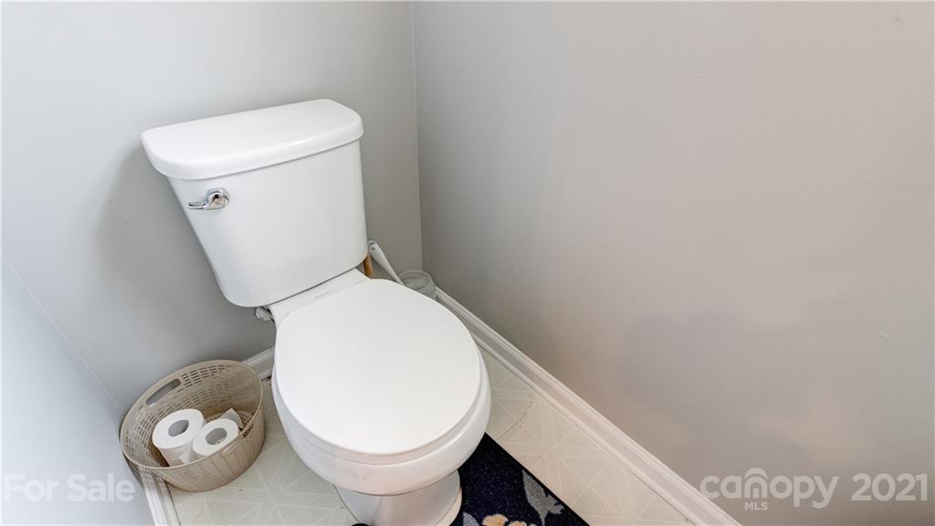 7103 Indian Ridge Lane Charlotte, NC 28214 - Photo 20 of 24 a close up of a toilet
