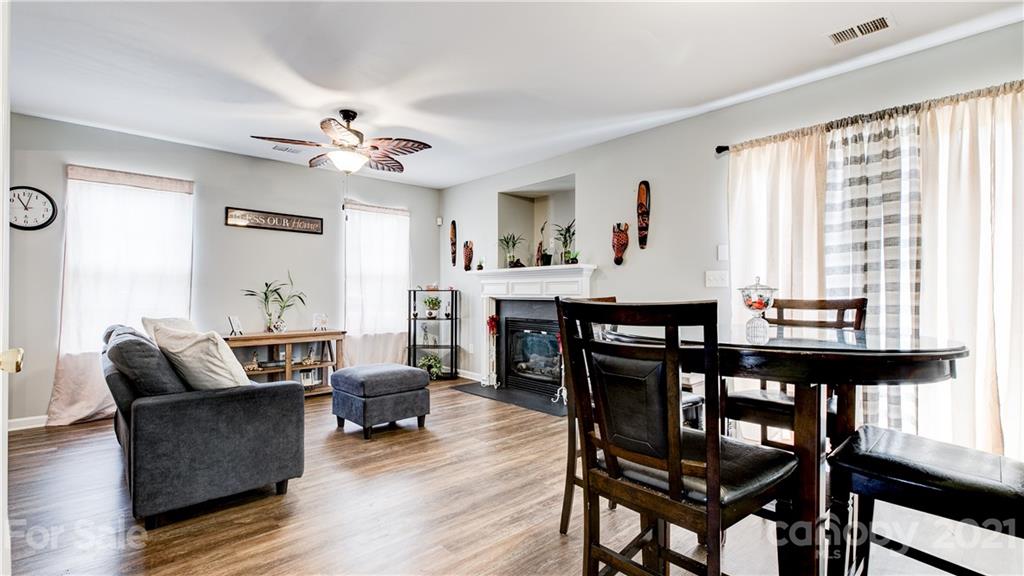 7103 Indian Ridge Lane Charlotte, NC 28214 - Photo 3 of 24 a living room with furniture and wooden floor
