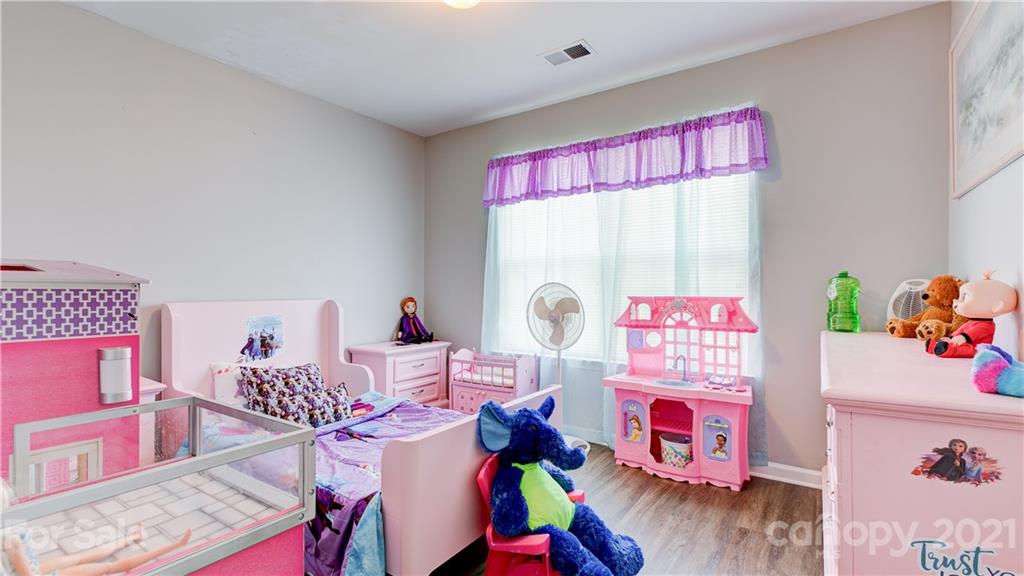 7103 Indian Ridge Lane Charlotte, NC 28214 - Photo 21 of 24 a bedroom with furniture and a bed