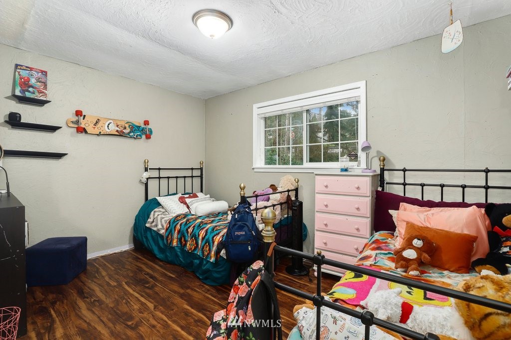 24008 7th Place West Bothell, WA 98021 - Photo 14 of 23 a bedroom with furniture and a window