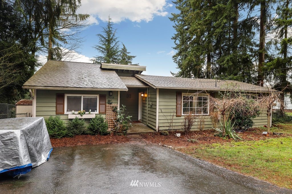 24008 7th Place West Bothell, WA 98021 - Photo 22 of 23 a view of a house with a yard plants and large tree