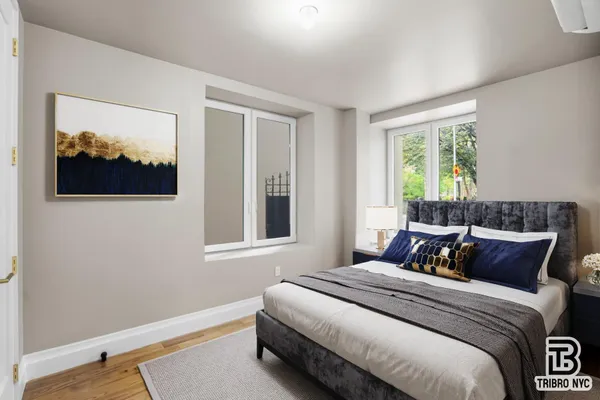 a bedroom with bed and a window