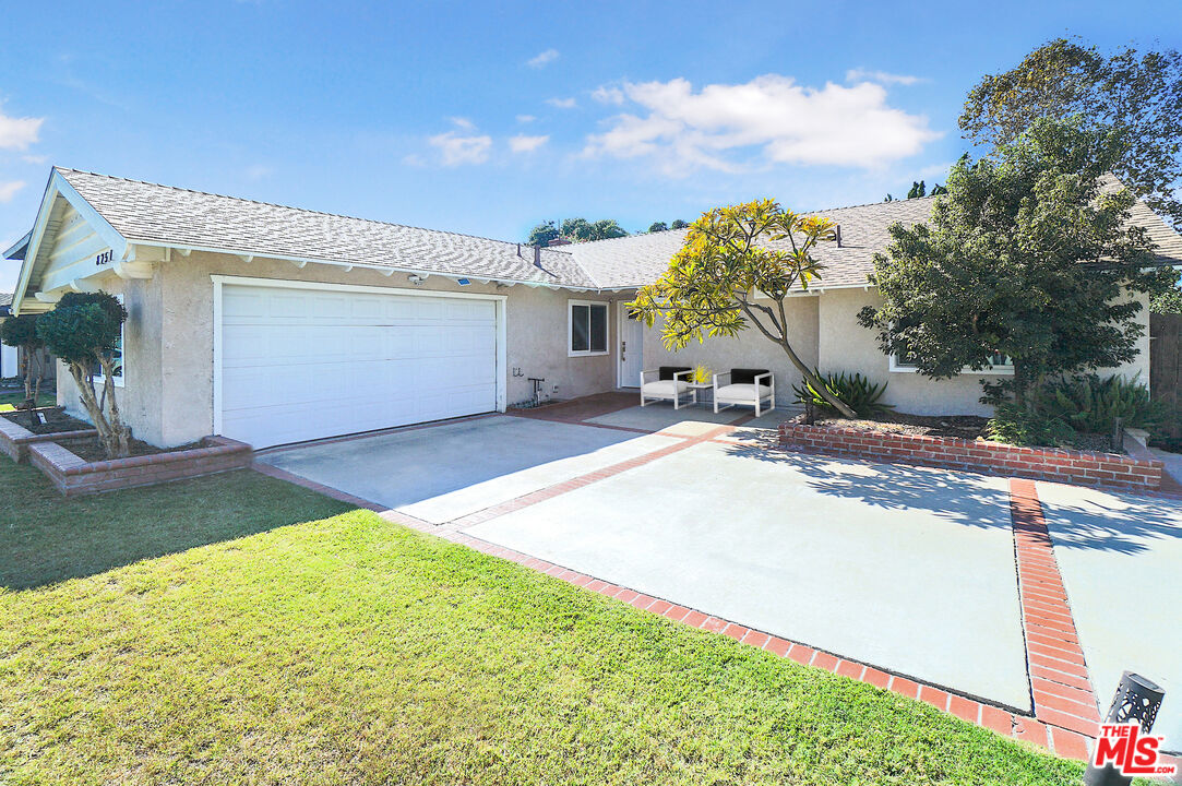 8251 Acacia Street Cypress, CA 90630 - Photo 11 of 13 a view of a backyard of the house
