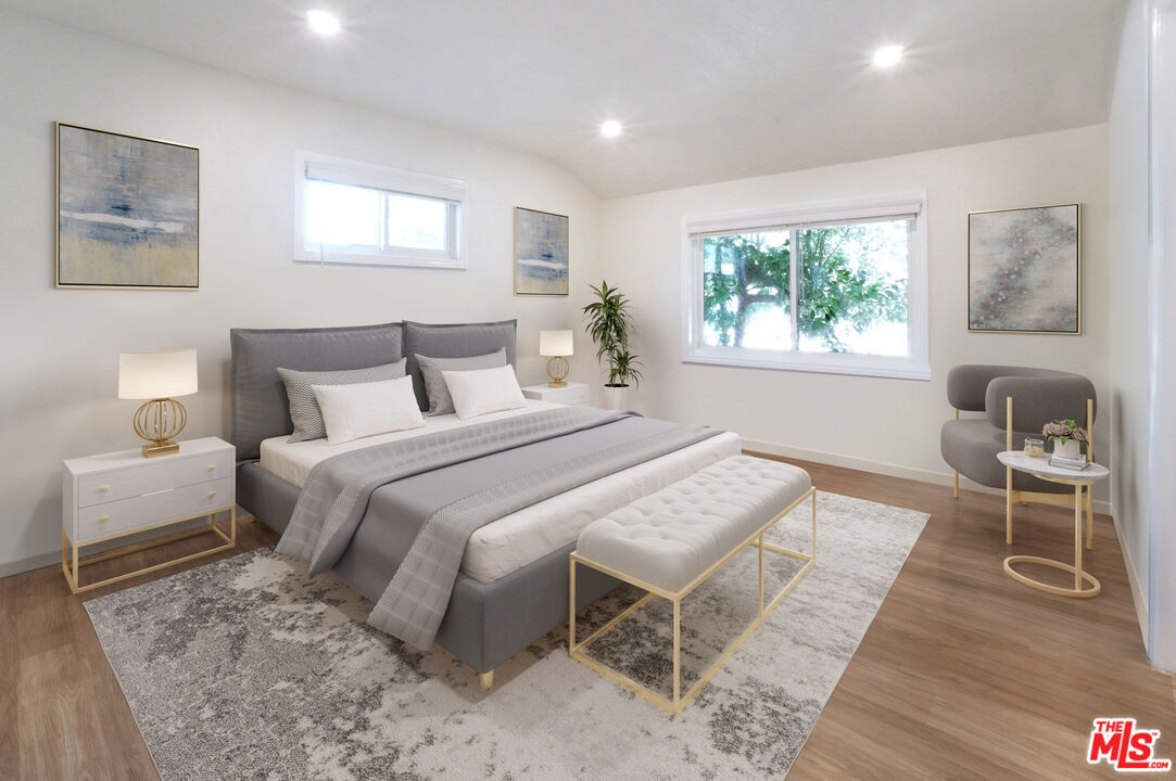 8251 Acacia Street Cypress, CA 90630 - Photo 5 of 13 a bedroom with a bed and a window