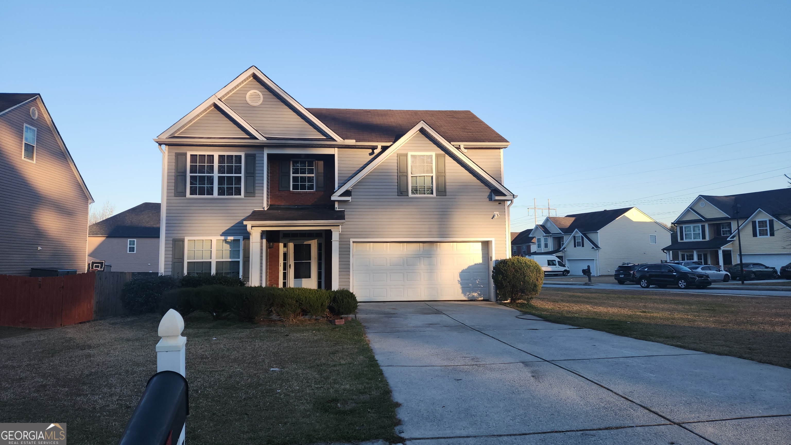 7402 Walton Hill Fairburn, GA 30213 - Photo 1 of 11 a front view of a house with a yard