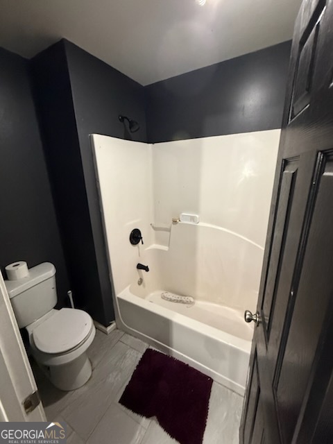 7402 Walton Hill Fairburn, GA 30213 - Photo 11 of 11 a white toilet sitting next to a bathroom sink and a shower
