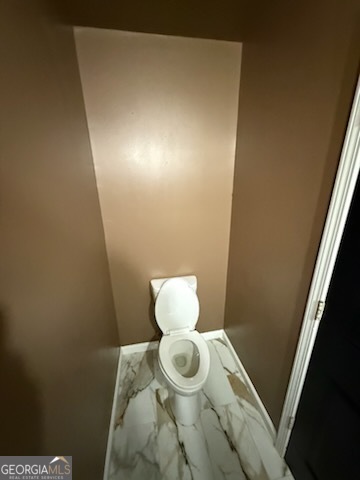 7402 Walton Hill Fairburn, GA 30213 - Photo 6 of 11 a bathroom with a toilet