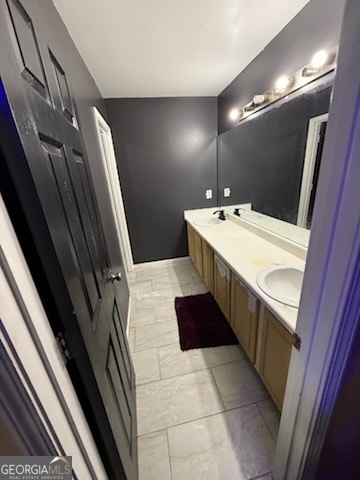 7402 Walton Hill Fairburn, GA 30213 - Photo 10 of 11 a bathroom with a sink a vanity and a mirror