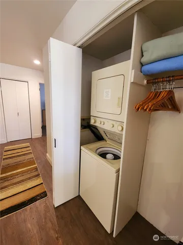 a view of a storage and utility room with washer and dryer