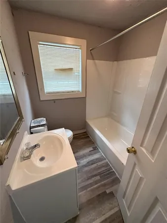 a bathroom with a bathtub and sink