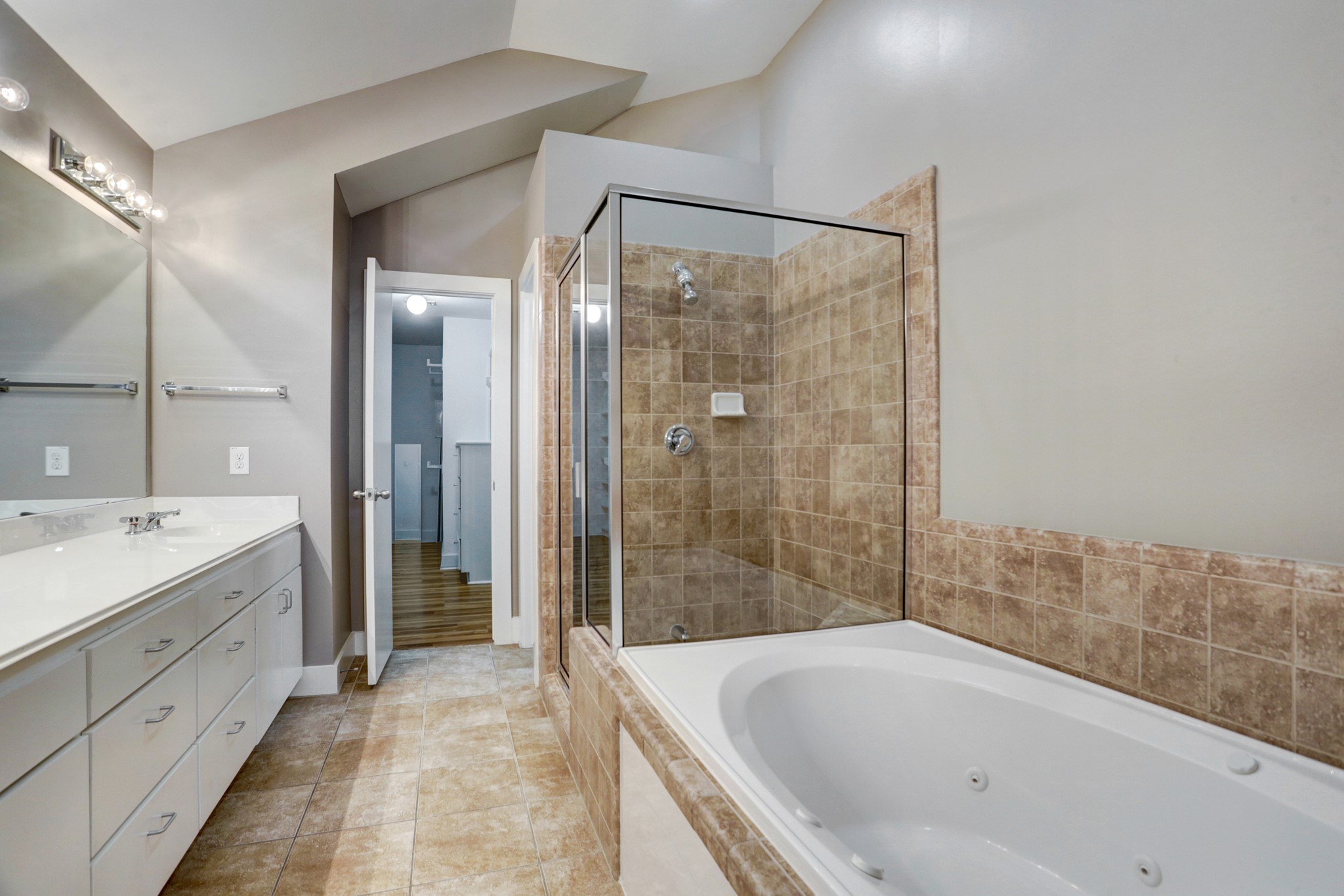 7650 Springhill Street, Unit 304 Houston, TX 77021 - Photo 12 of 18 a bathroom with a bathtub and a sink