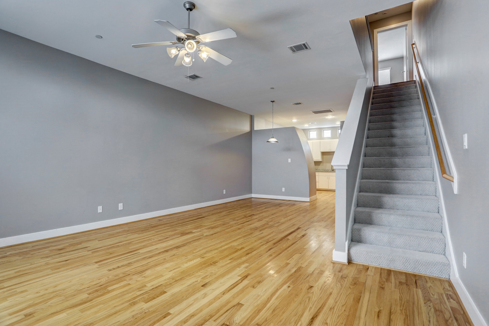 7650 Springhill Street, Unit 304 Houston, TX 77021 - Photo 5 of 18 wooden floor in an empty room with a window
