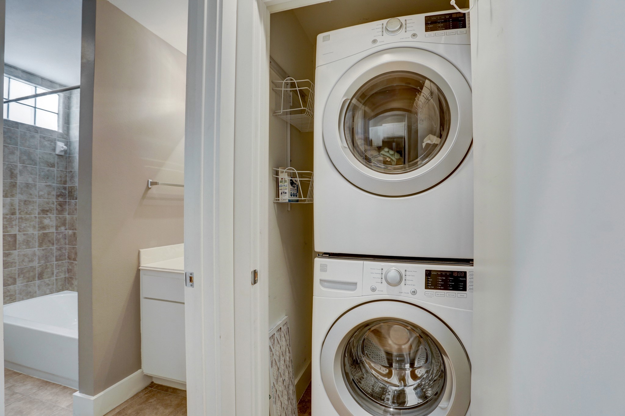 7650 Springhill Street, Unit 304 Houston, TX 77021 - Photo 7 of 18 a view of a hallway with washer and dryer