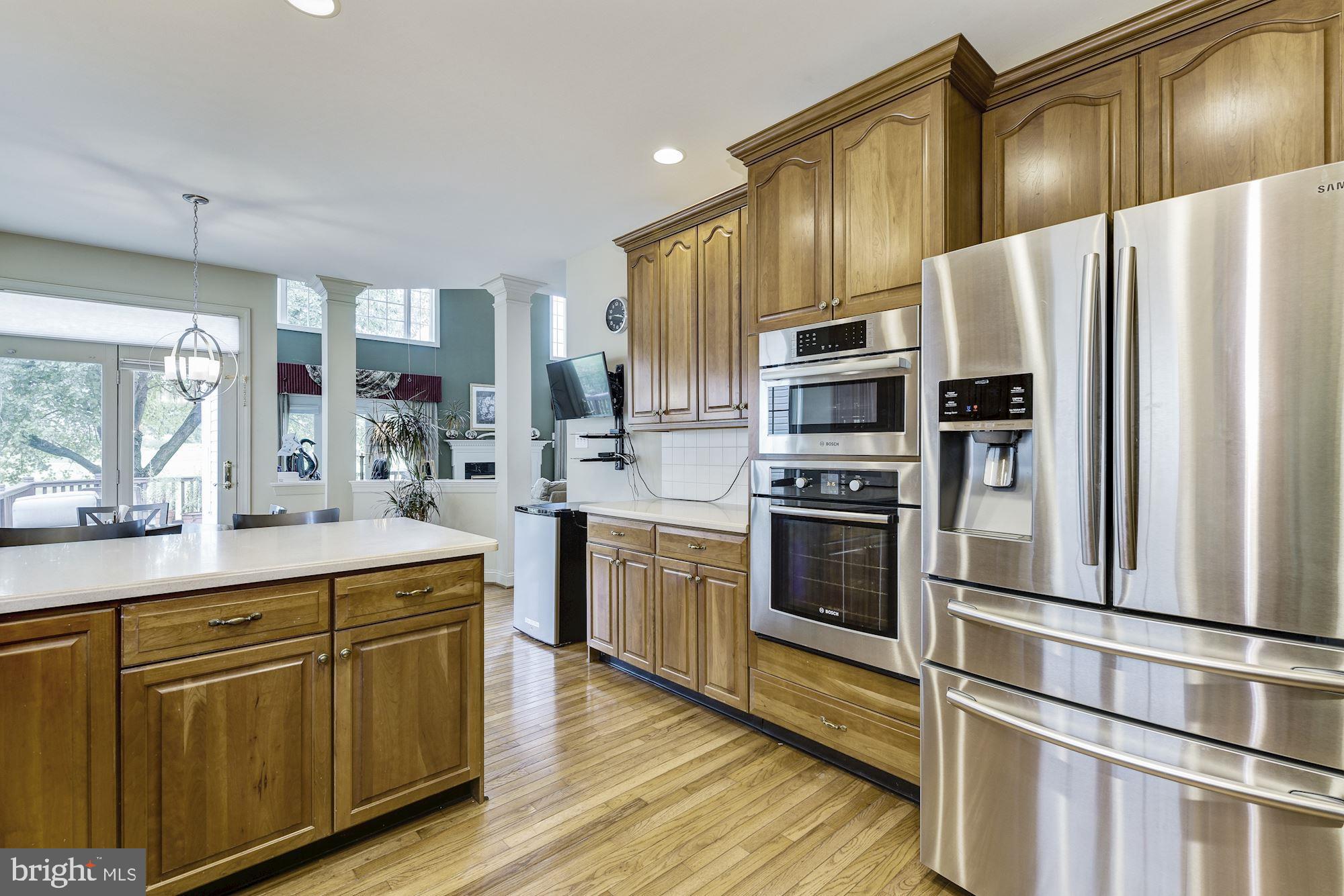 126 Augusta Drive Moorestown, NJ 08057 - Photo 11 of 33 a kitchen with kitchen island granite countertop stainless steel appliances and refrigerator