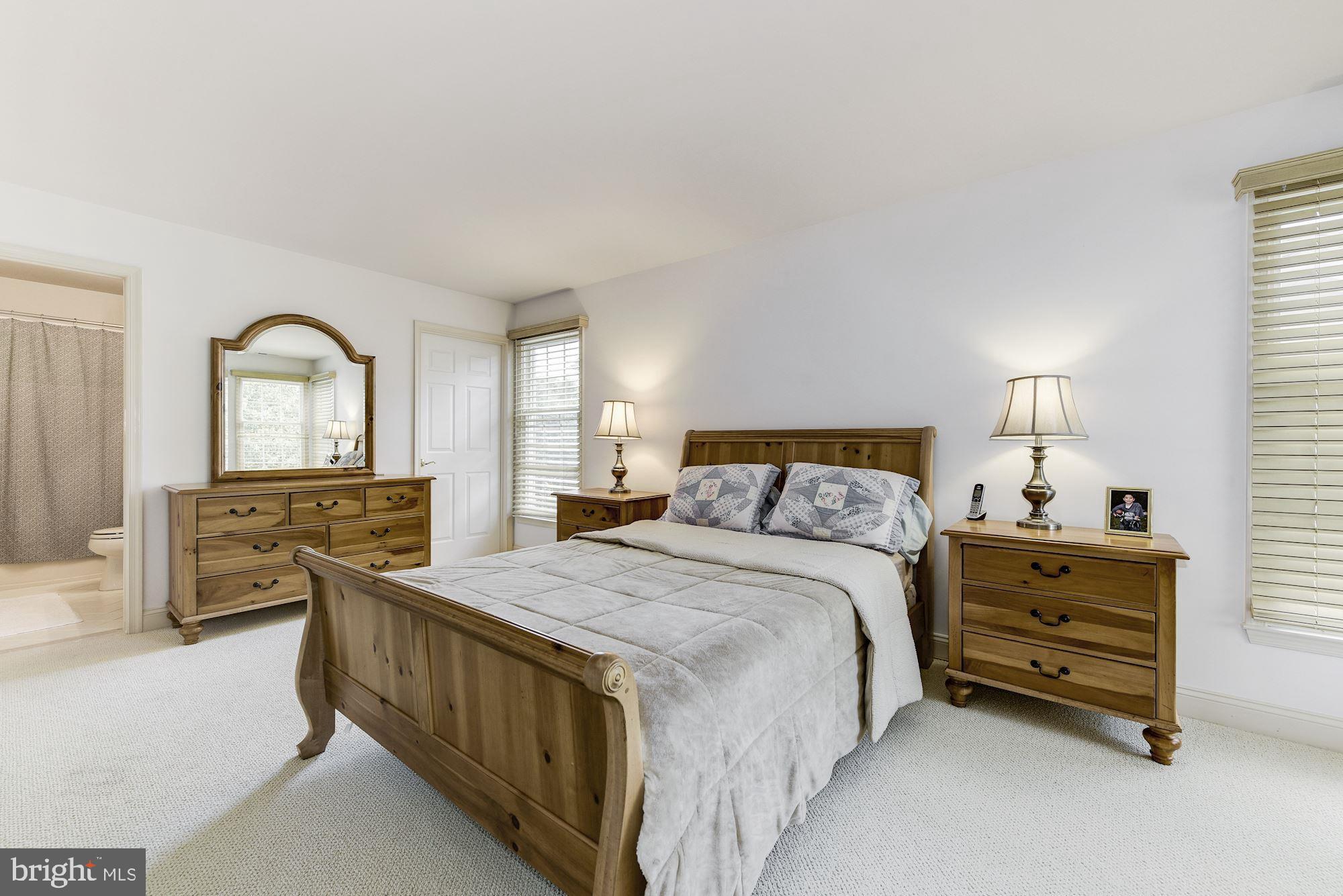 126 Augusta Drive Moorestown, NJ 08057 - Photo 22 of 33 a spacious bedroom with a bed a dresser and mirror